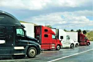 tractor trailers parked in a line